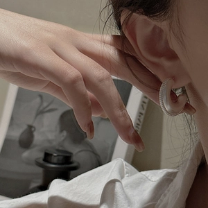 Minimalist S925 sterling silver C-shaped hoop earrings with a textured matte finish