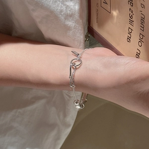 Elegant 925 sterling silver bamboo joint bracelet with S-hook clasp worn by a model