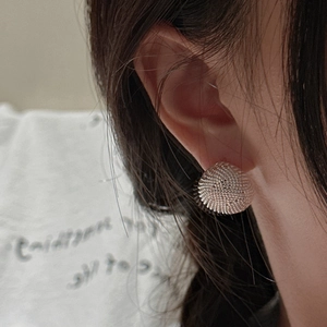 Minimalist S925 sterling silver mesh textured stud earrings shown on model ear
