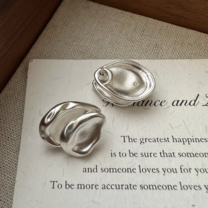 Minimalist S925 sterling silver irregular wave earrings with a matte vintage finish