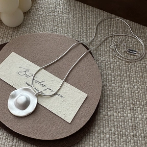 Minimalist S925 sterling silver necklace with a matte irregular round pendant and snake chain