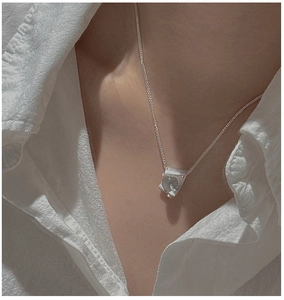 Detail of S925 sterling silver necklace with a grey crystal pendant on a silver chain
