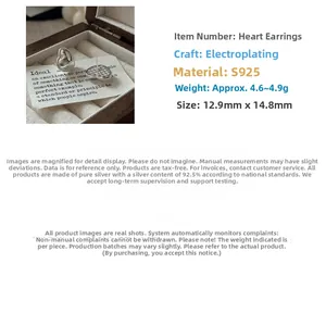 Macro shot of S925 sterling silver heart earrings with detailed size measurements
