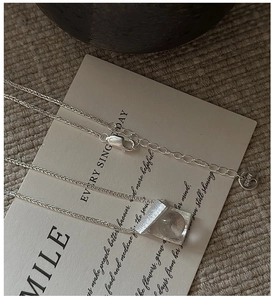 Detailed close-up of S925 sterling silver necklace showing lobster clasp and AG925 hallmark