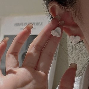 Minimalist S925 sterling silver heart stud earrings with a brushed metallic finish