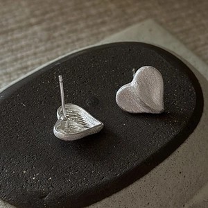 Minimalist S925 sterling silver heart stud earrings with a brushed metallic finish