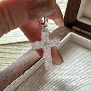 S925 sterling silver cross pendant with a brushed matte finish and starburst zircon stone