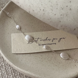 S925 sterling silver bracelet with brushed oval charms on a minimalist chain