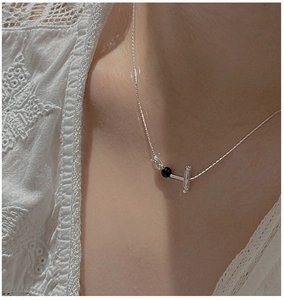 Minimalist S925 silver necklace with black bead and T-bar pendant on a delicate chain