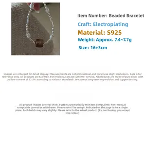 Detail view of S925 sterling silver beaded bracelet with vintage wood accent beads