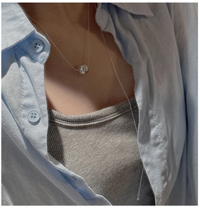 Minimalist S925 silver beaded long necklace shown on a model neck with a polished sphere