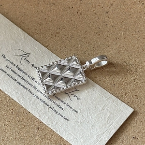 S925 sterling silver geometric rectangular pendant with faceted surface and beaded edge