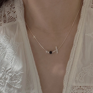 Minimalist S925 silver necklace with black bead and clear tube pendants on a model