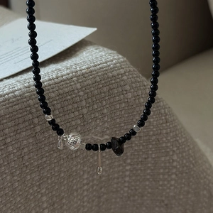 Retro S925 silver necklace with black beads, stone pendant, and metallic needle charm