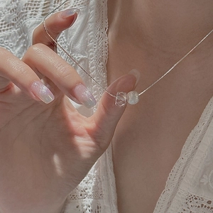 Minimalist S925 silver necklace with white crystal and brushed beads worn by model