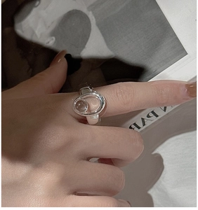 Macro shot of S925 sterling silver ring with interlocking oval and round design detail