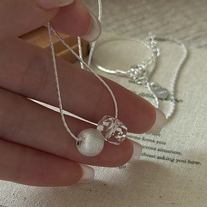 S925 sterling silver necklace with a brushed bead and faceted clear crystal pendant