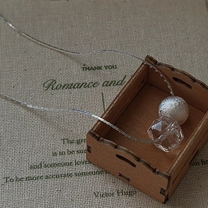 S925 sterling silver necklace with a matte bead and faceted white crystal pendant