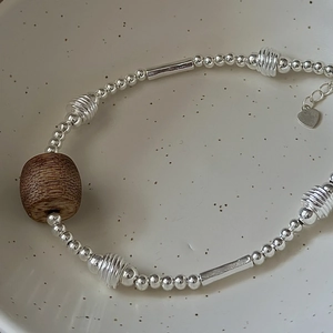 S925 sterling silver beaded bracelet featuring vintage wood beads and heart charm