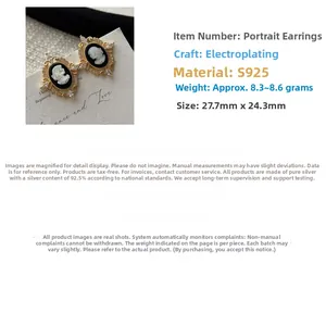 Detail showing vintage S925 silver cameo earrings with golden frame and embossed portrait