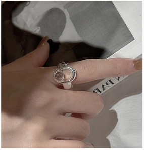 Close-up of S925 sterling silver ring with crystal sphere and irregular organic design