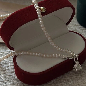 Elegant S925 silver pearl necklace with tassel pendant in a luxury red velvet jewelry box