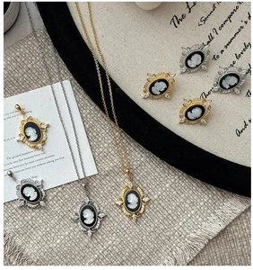Macro detail of vintage cameo jewelry set with relief portrait and stone accents