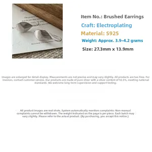Detail view of S925 sterling silver leaf earrings with a brushed texture and dimensions
