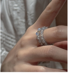 Detail of S925 sterling silver beaded ring with labradorite stones and a gold accent