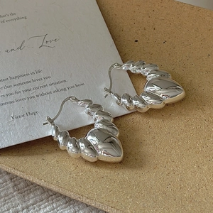 Minimalist S925 sterling silver croissant hoop earrings with a twisted hollow design