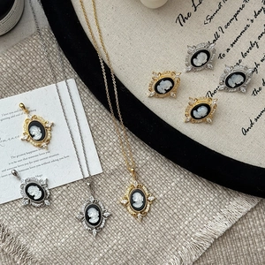 Vintage S925 silver cameo jewelry set including necklace and earrings with baroque metal frames