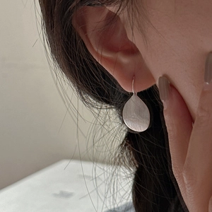 Minimalist S925 sterling silver drop earrings with brushed metal leaf texture