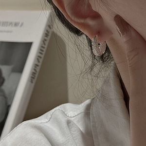 Vintage woven texture S925 sterling silver hoop earrings shown on a model