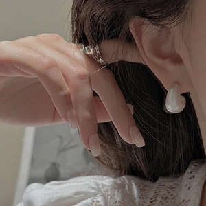 French vintage matte heart earrings and silver ring set on a model with lace collar