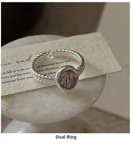Macro detail of S925 silver twist ring with oval black rutilated quartz gemstone