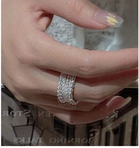 Detail of S925 sterling silver beaded multilayer ring on hand with bohemian style
