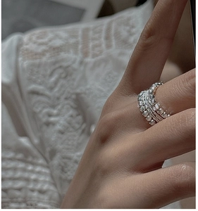 Detail of S925 sterling silver beaded ring with stackable twisted texture on hand