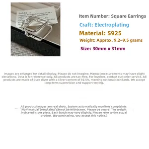 Macro shot of geometric S925 sterling silver square hoop earrings sized 30mm by 31mm