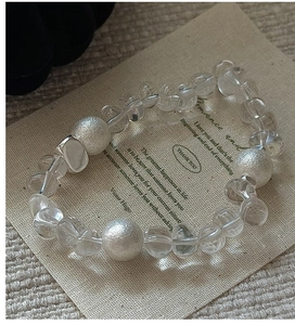 Detail of beaded S925 silver bracelet featuring clear crystals and frosted silver beads