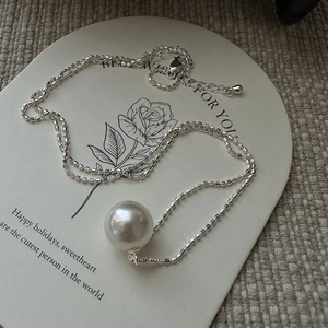 Elegant S925 sterling silver pearl pendant necklace on a decorative gift card