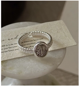 Macro view of S925 silver ring with twisted rope band and oval black rutilated quartz stone