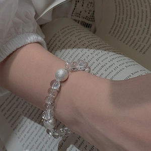Minimalist S925 sterling silver beaded bracelet with clear crystals on a woman's wrist