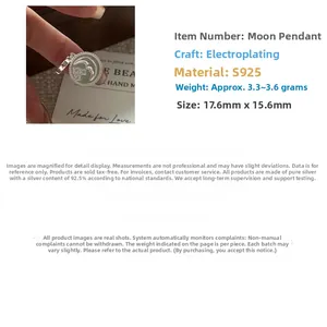 Macro view of S925 sterling silver moon and star pendant with detailed engraving
