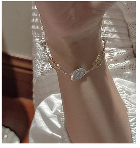 Detail of beaded S925 silver bracelet with faceted yellow citrine gemstones on wrist