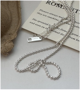 Macro shot of S925 sterling silver bead necklace with AG925 hallmark and extender chain