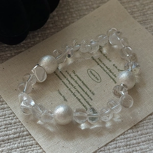 Minimalist S925 silver beaded bracelet with clear crystals on natural linen bag