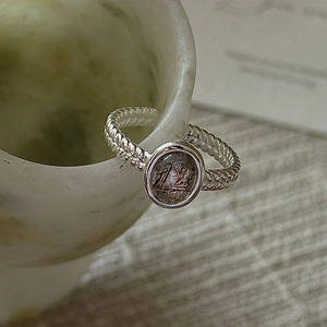 Minimalist S925 silver twist ring featuring an oval rutilated quartz gemstone centerpiece