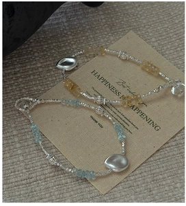Detail of S925 silver beaded bracelets with aquamarine and citrine faceted stones