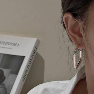 Minimalist S925 sterling silver rectangular hoop earrings shown on ear for a modern look