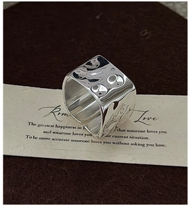 Detailed view of S925 silver ring featuring a unique irregular hammered metal texture